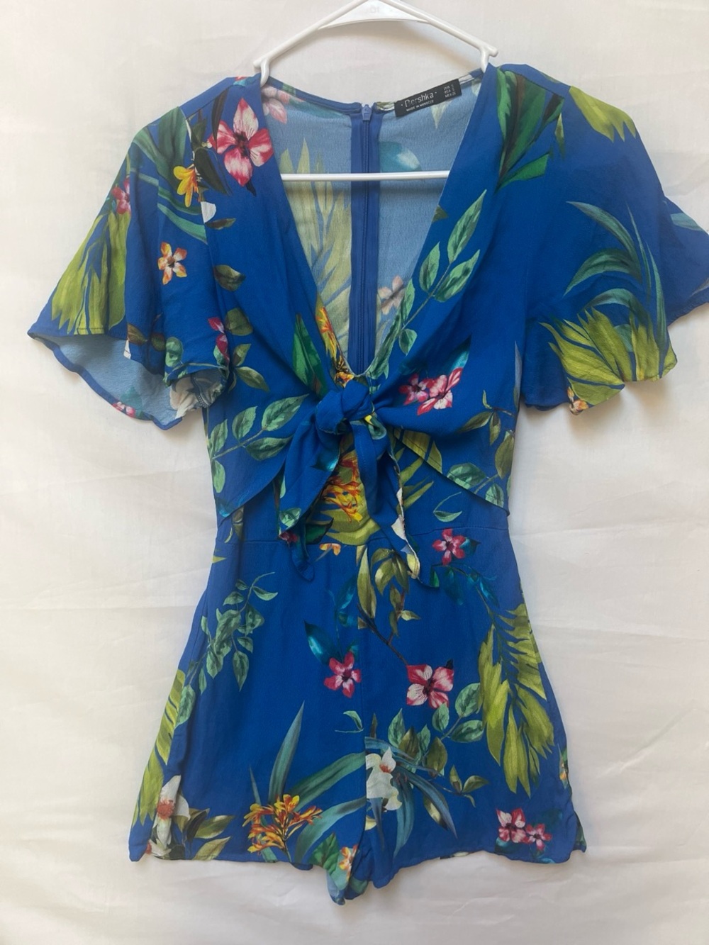 Bershka Blue Tropical Floral Tie-Front Romper
PTP: 14, SS: 29in
Small hole- seam